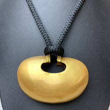 Load image into Gallery viewer, Phoenix Art Museum Goldtone 3&quot; Modern Art Pendant on Black Cord Necklace (30&quot; Adjustable)
