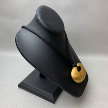 Load image into Gallery viewer, Phoenix Art Museum Goldtone 3&quot; Modern Art Pendant on Black Cord Necklace (30&quot; Adjustable)
