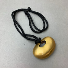 Load image into Gallery viewer, Phoenix Art Museum Goldtone 3" Modern Art Pendant on Black Cord Necklace (30" Adjustable)
