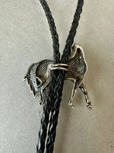 Load image into Gallery viewer, Vintage Sterling Silver Walking Horse Relief Black Leather Bolo Tie

