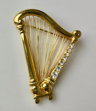 Load image into Gallery viewer, Vintage Monet Goldtone Swarovski Crystal Rhinestone Harp Brooch Pin (2")

