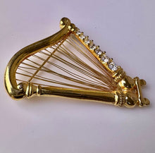 Load image into Gallery viewer, Vintage Monet Goldtone Swarovski Crystal Rhinestone Harp Brooch Pin (2&quot;)
