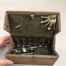 Load image into Gallery viewer, 1889 Singer Sewing Machine Attachments in Folding Wooden Puzzle Box (3x6)
