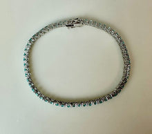 Load image into Gallery viewer, Rhodium Plated Simulated Blue Topaz Tennis Bracelet (7.5")
