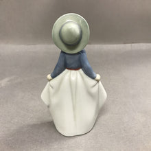 Load image into Gallery viewer, Nao by Lladro Girl Holding Her Skirt Figurine (7")
