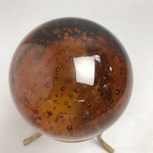 Load image into Gallery viewer, Vintage Glass Art Amber Paperweight with Bubbles on Stand (8")

