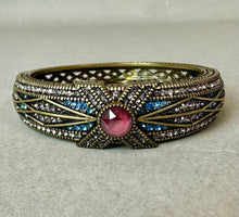 Load image into Gallery viewer, Heidi Daus Tapered X Bronze Blue &amp; Pink Crystal Hinged Bangle Bracelet (7.5" Inside Circumference)
