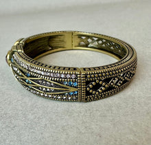 Load image into Gallery viewer, Heidi Daus Tapered X Bronze Blue &amp; Pink Crystal Hinged Bangle Bracelet (7.5" Inside Circumference)
