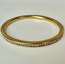 Load image into Gallery viewer, Goldtone Channel Set Cubic Zirconia Rounded Bangle Bracelet (8" Inside Circumference)
