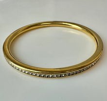 Load image into Gallery viewer, Goldtone Channel Set Cubic Zirconia Rounded Bangle Bracelet (8" Inside Circumference)
