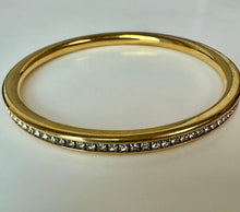 Load image into Gallery viewer, Goldtone Channel Set Cubic Zirconia Rounded Bangle Bracelet (8" Inside Circumference)
