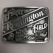 Load image into Gallery viewer, First in Remington The Field Pewter Belt Buckle (2x3)
