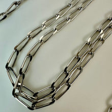 Load image into Gallery viewer, Vintage Monet Silvertone Twisted Paperclip Chain Necklace (54")
