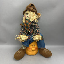 Load image into Gallery viewer, Scarecrow Sitting on Pumpkin Plush Decor (18")
