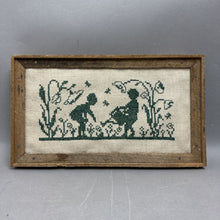 Load image into Gallery viewer, Framed Handmade Boy &amp; Girl Watering Flowers Cross Stitch Piece (7x12.5")
