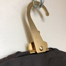 Load image into Gallery viewer, Louis Vuitton Brown Nylon Foldable Garment Bag on Gold LV Hanger
